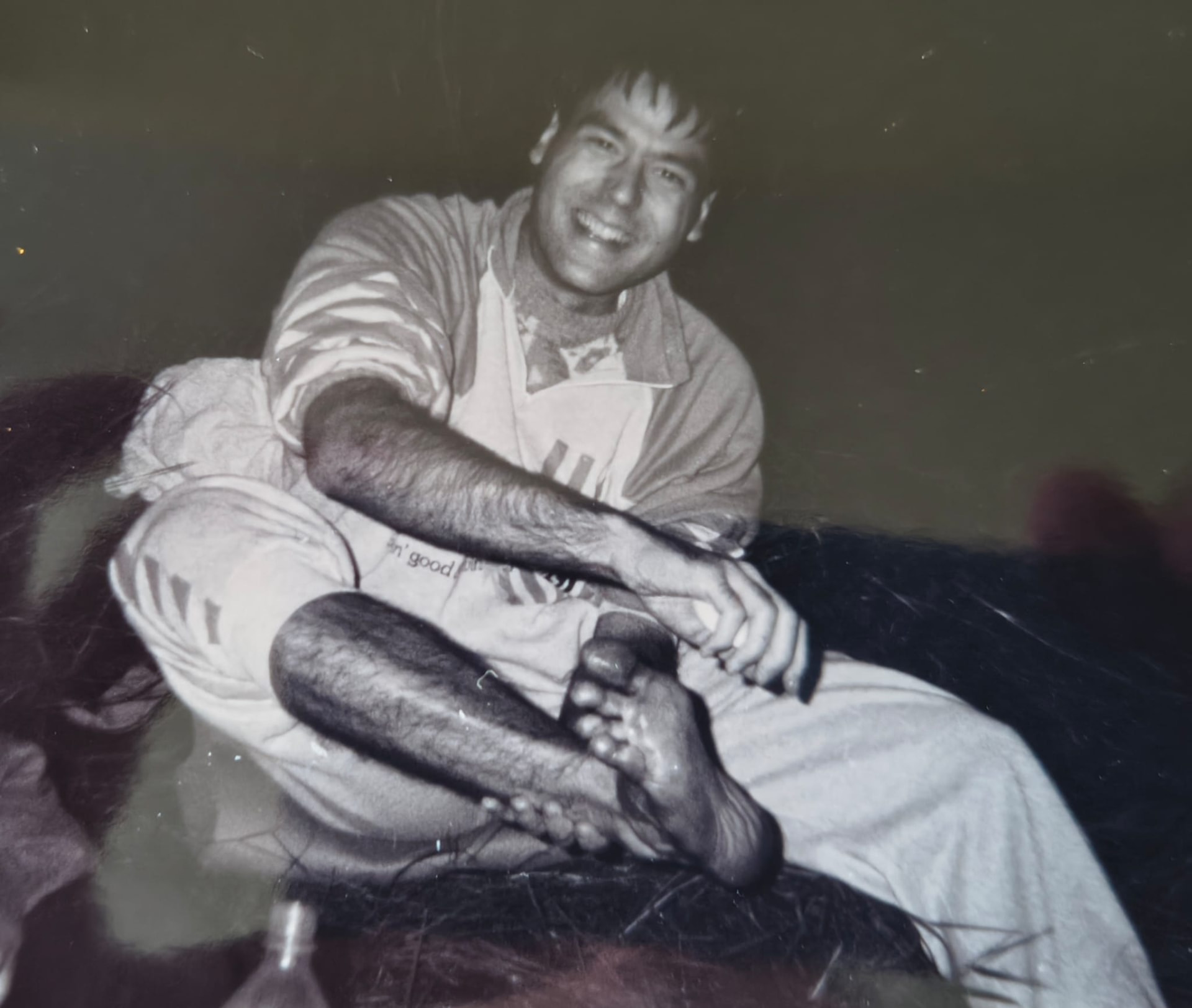 Balazs as a young man, laughing while sitting on the back of a horse