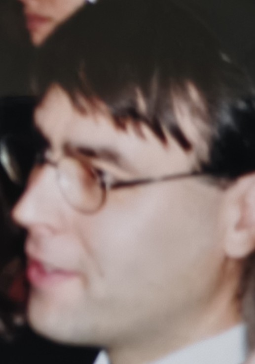 Balazs in profile, wearing round glasses, in an old photograph